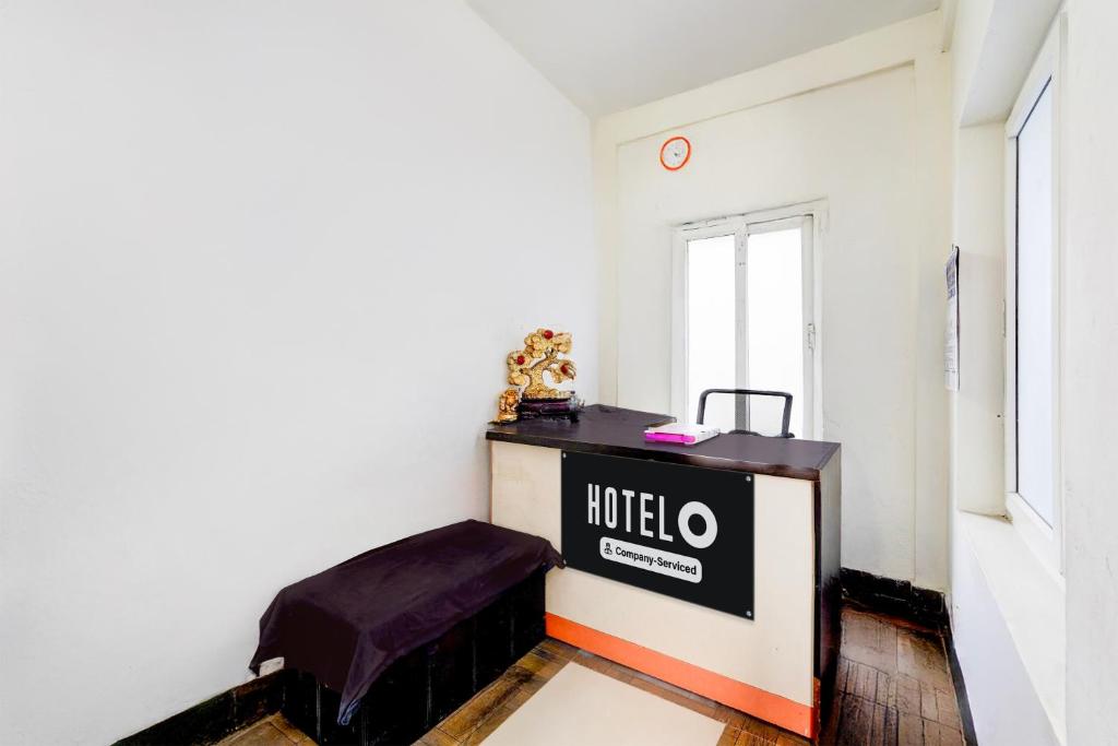 Postel nebo postele na pokoji v ubytování Super Hotel O ECR Injambakkam Formerly Nimalan Residency