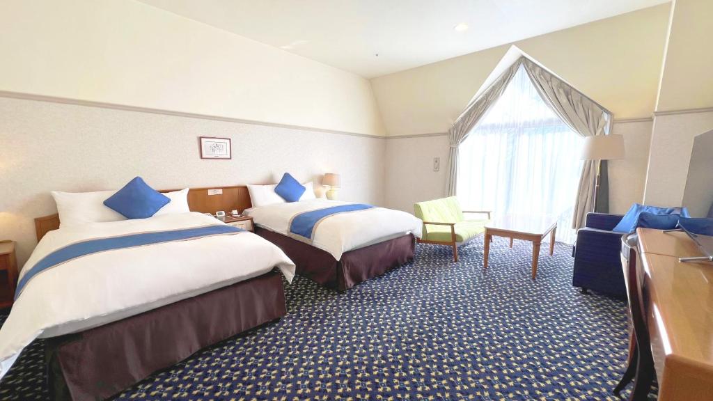 Postel nebo postele na pokoji v ubytování Hotel Floracion Nasu