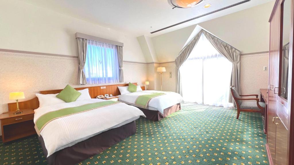 Postel nebo postele na pokoji v ubytování Hotel Floracion Nasu