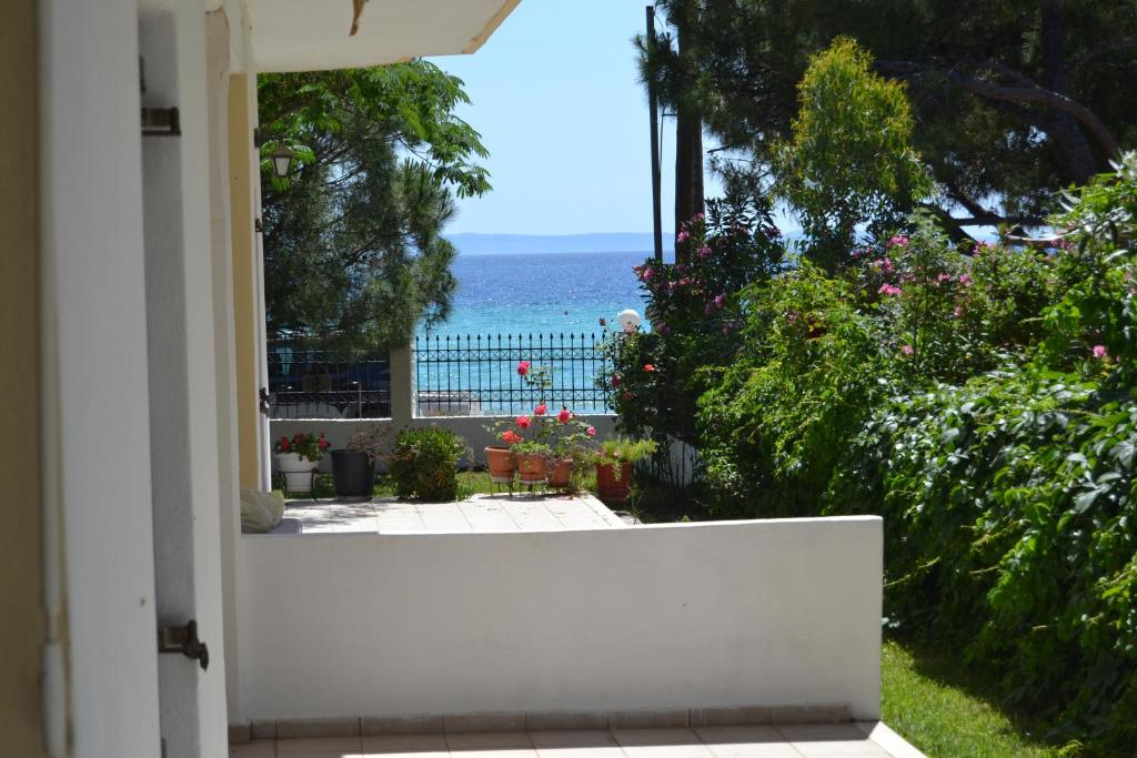 a view of the ocean from the porch of a house at House Anna in Nikiti