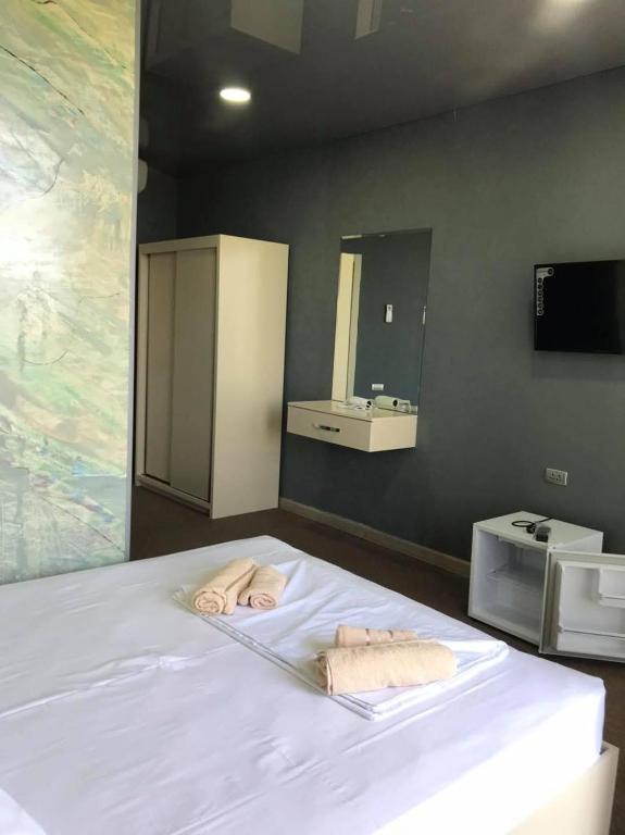 Postel nebo postele na pokoji v ubytování Comfortium