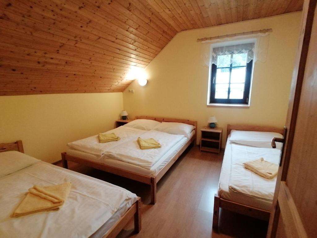 Postel nebo postele na pokoji v ubytování Chalupa Sluníčko