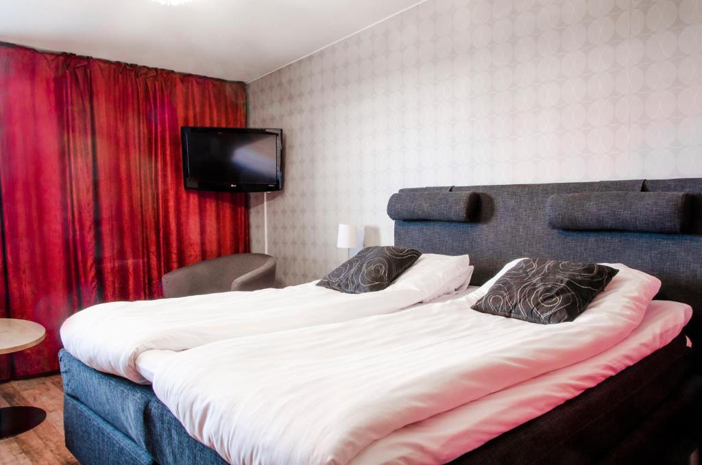 Postel nebo postele na pokoji v ubytování Hotell Wilhelmina