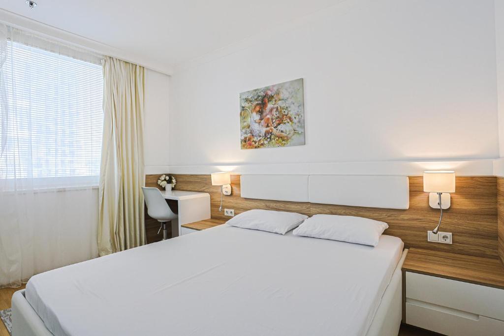 Postel nebo postele na pokoji v ubytování Vienna Apartments Hauptbahnhof