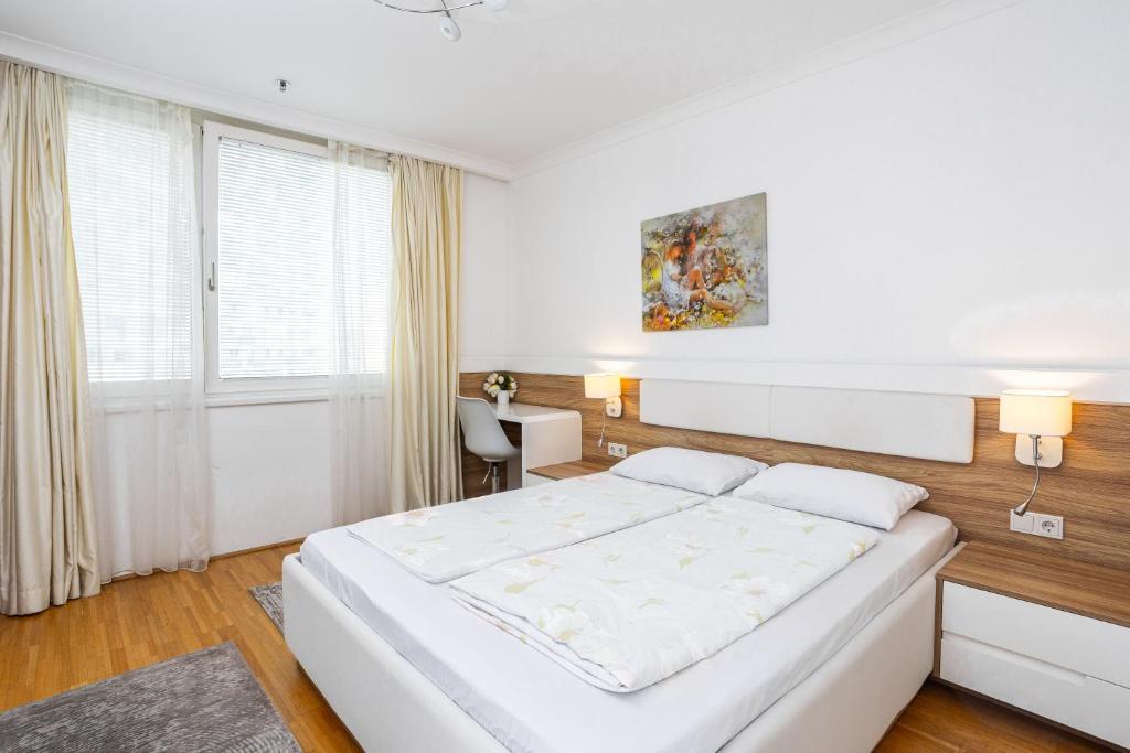 Postel nebo postele na pokoji v ubytování Vienna Apartments Hauptbahnhof