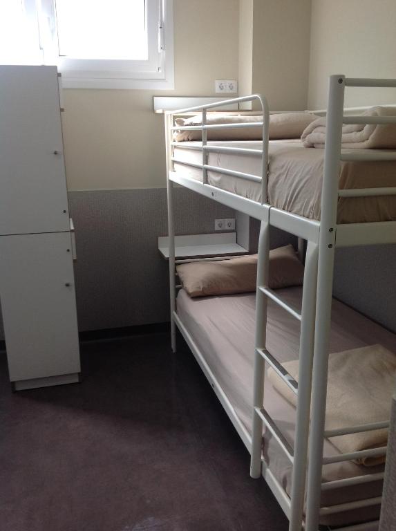 Postel nebo postele na pokoji v ubytování Albergue As Eiras