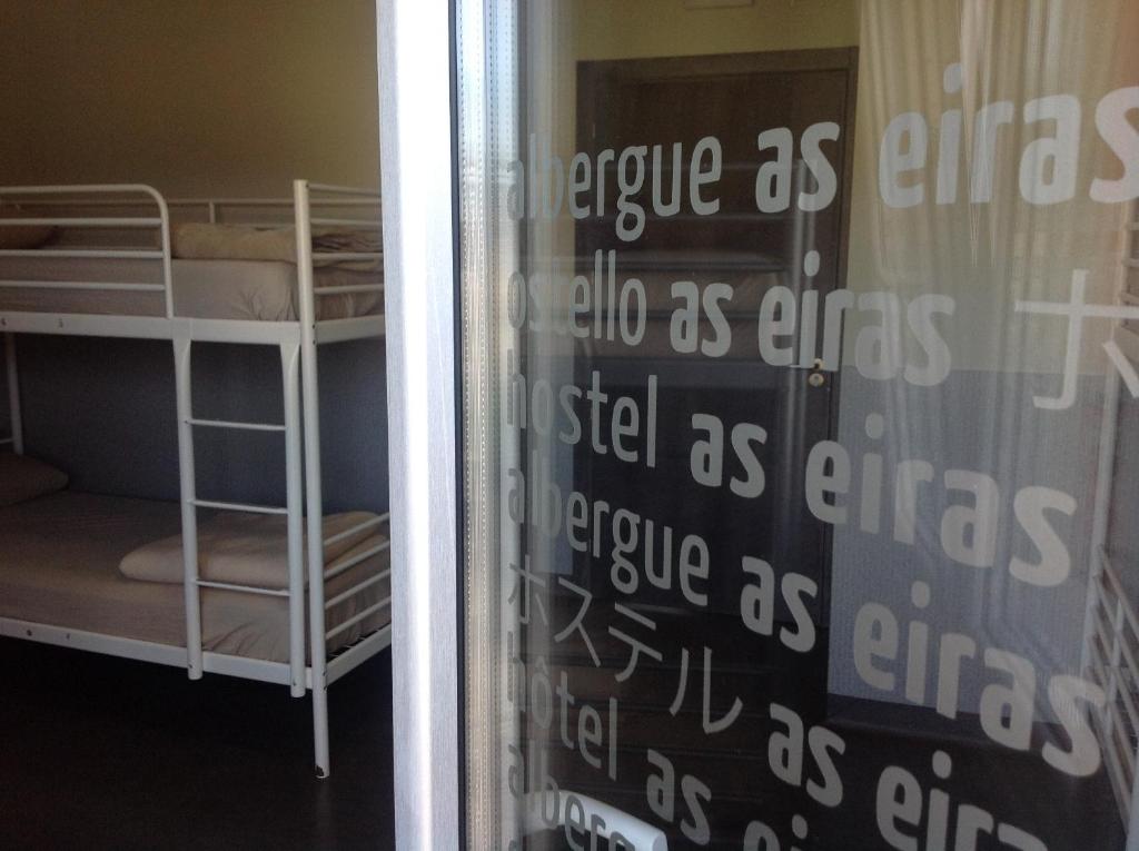 Postel nebo postele na pokoji v ubytování Albergue As Eiras