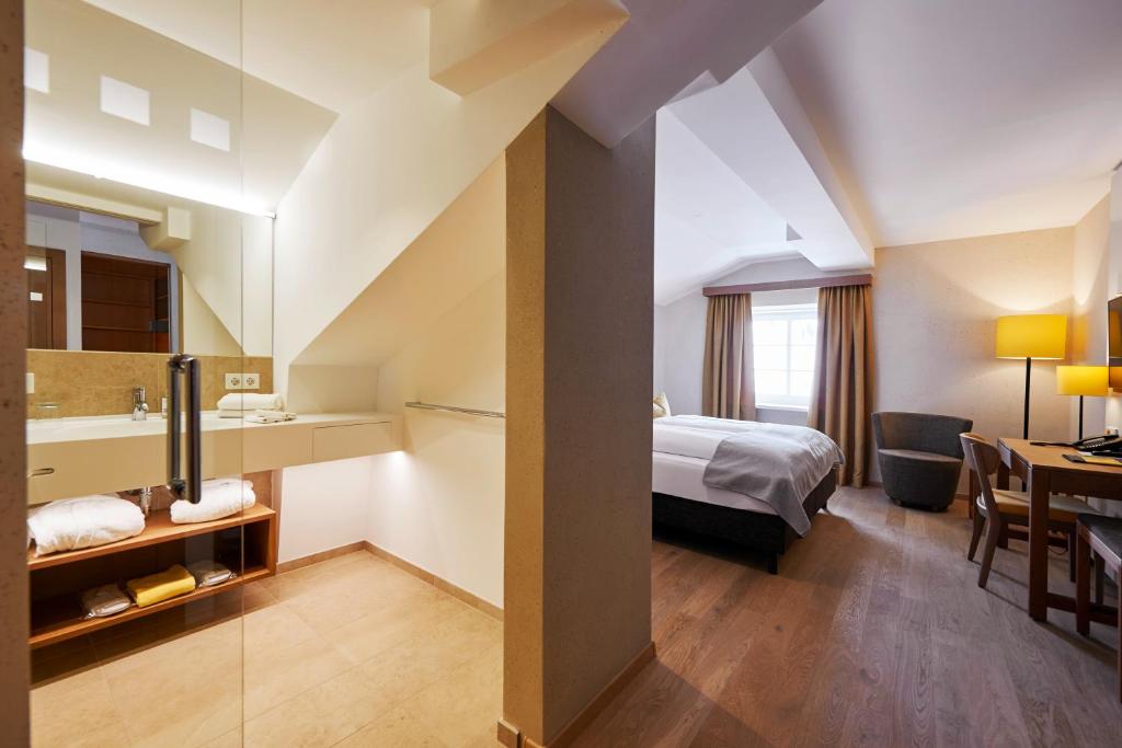 Postel nebo postele na pokoji v ubytování Après Post Hotel