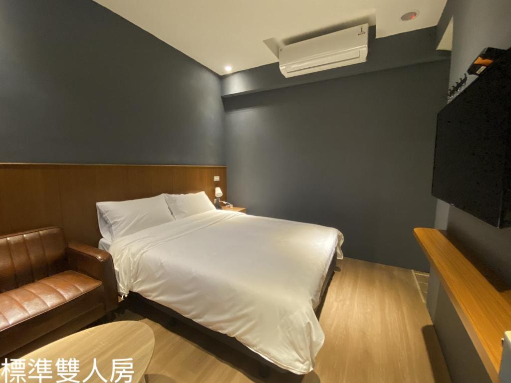 Vuode tai vuoteita majoituspaikassa 台南漫居民宿
