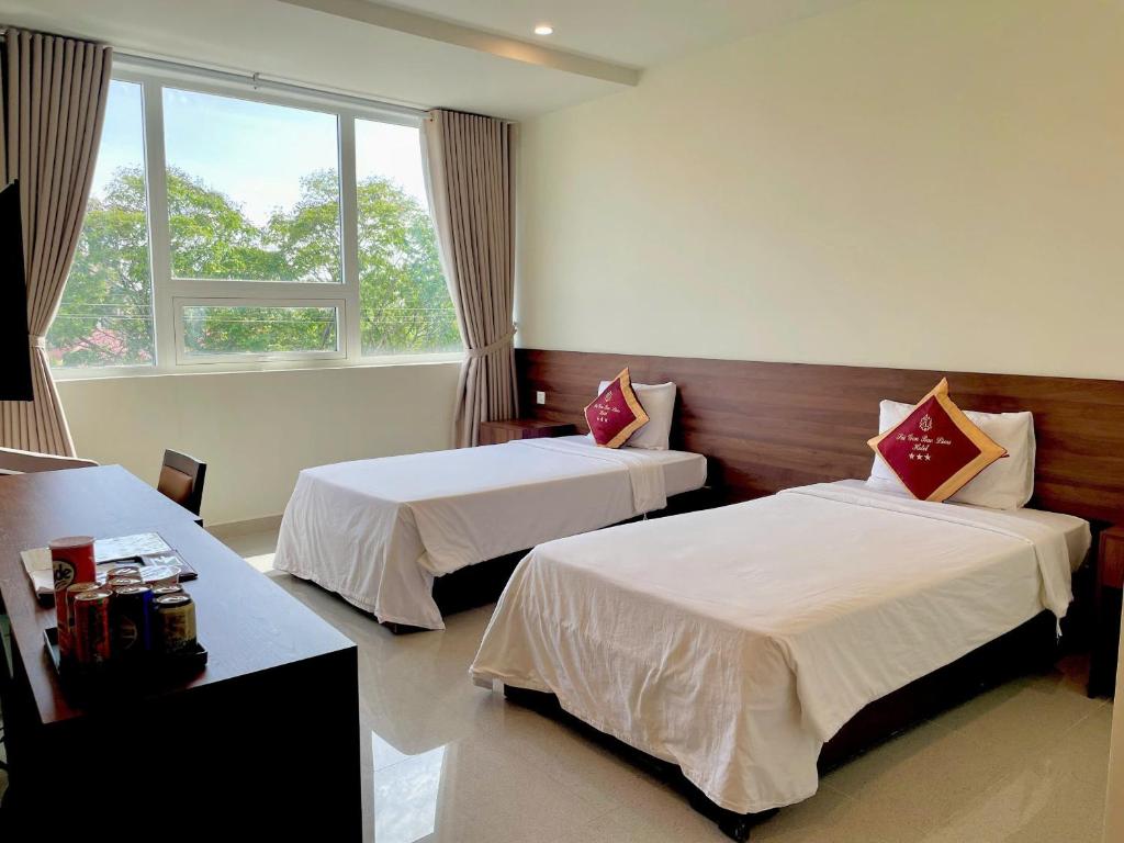 Postel nebo postele na pokoji v ubytování SÀI GÒN - BẠC LIÊU Hotel