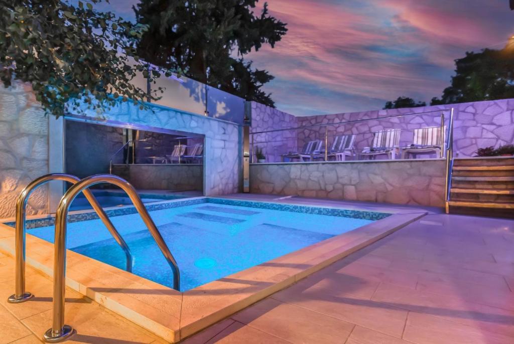 a swimming pool in a house at MSV Modern Stone Villa in Imotski