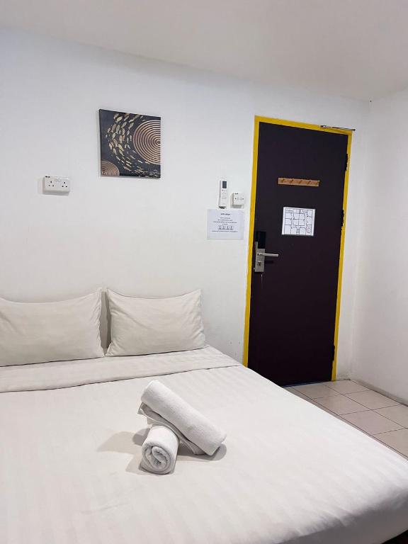 Postel nebo postele na pokoji v ubytování Hotel Seroja