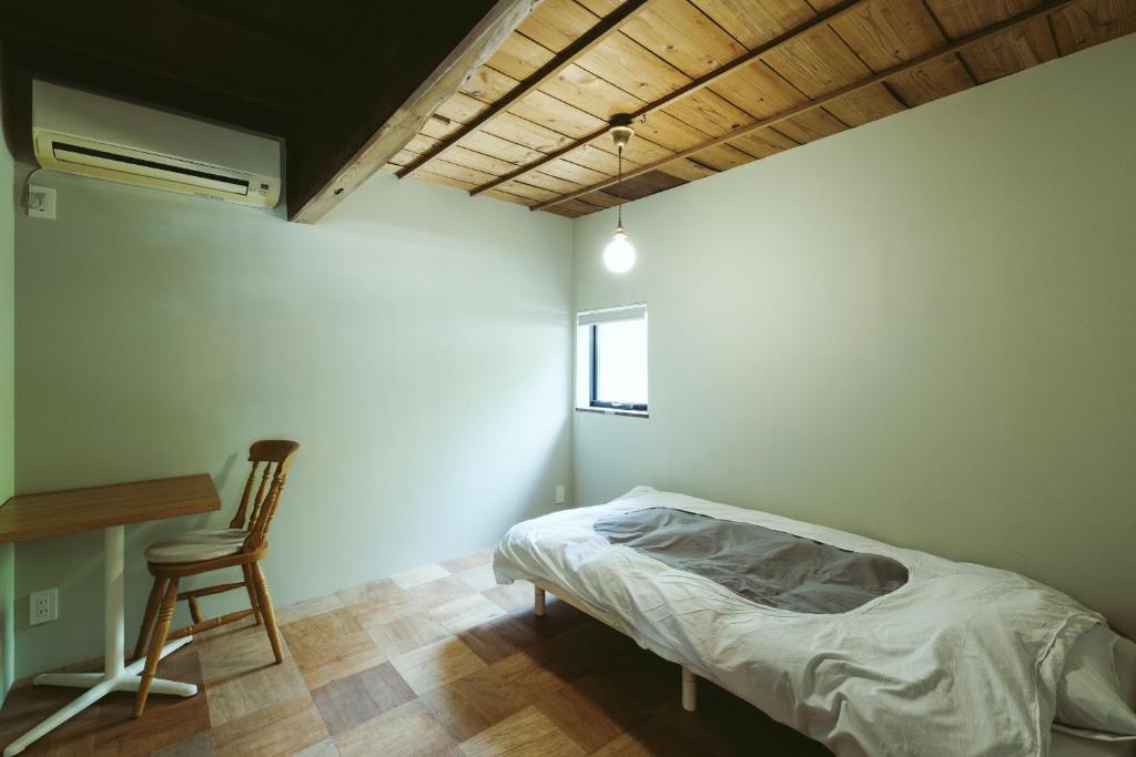Postel nebo postele na pokoji v ubytování kido