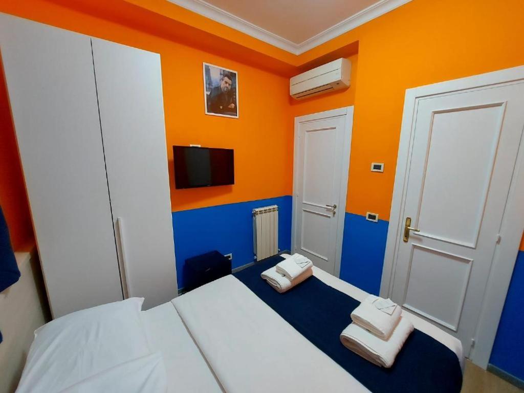 Postel nebo postele na pokoji v ubytování Hotel Positano