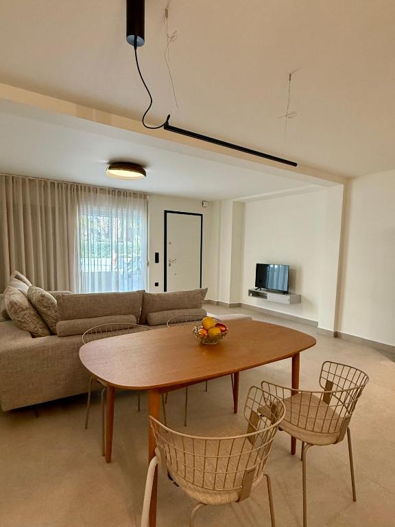a living room with a table and a couch at Ble city in Karpathos