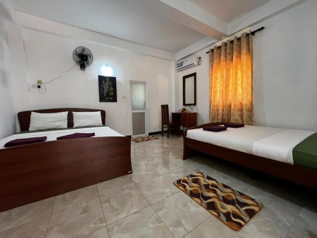 Postel nebo postele na pokoji v ubytování Ima Villa Sigiriya