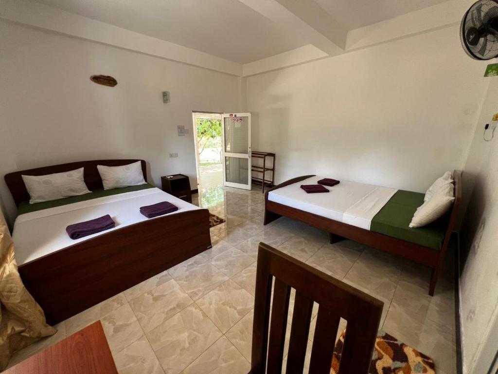 Postel nebo postele na pokoji v ubytování Ima Villa Sigiriya