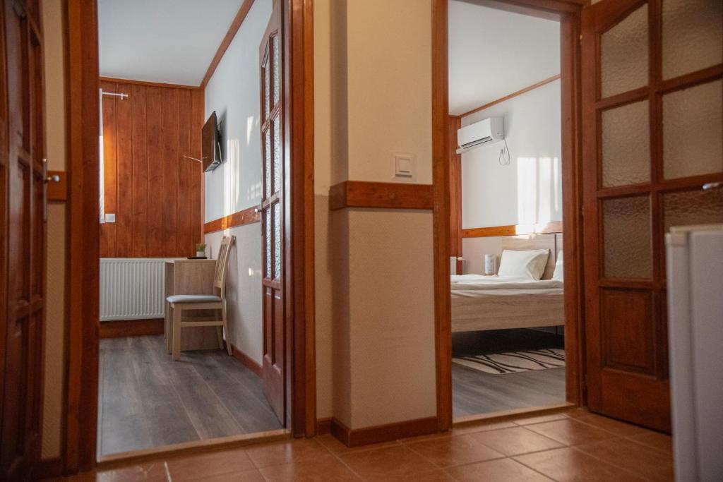 Posteľ alebo postele v izbe v ubytovaní Vadkacsa Panzio