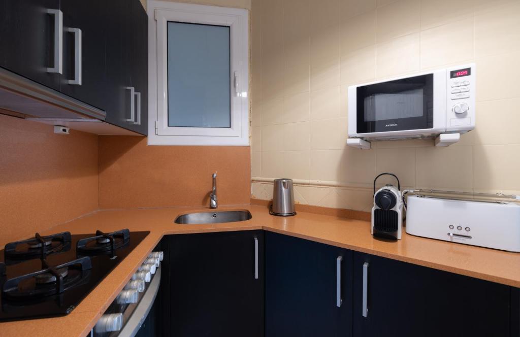 Kuchyň nebo kuchyňský kout v ubytování Stay U-nique Apartments Floridablanca