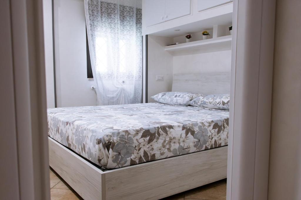 Ένα ή περισσότερα κρεβάτια σε δωμάτιο στο Casetta 46