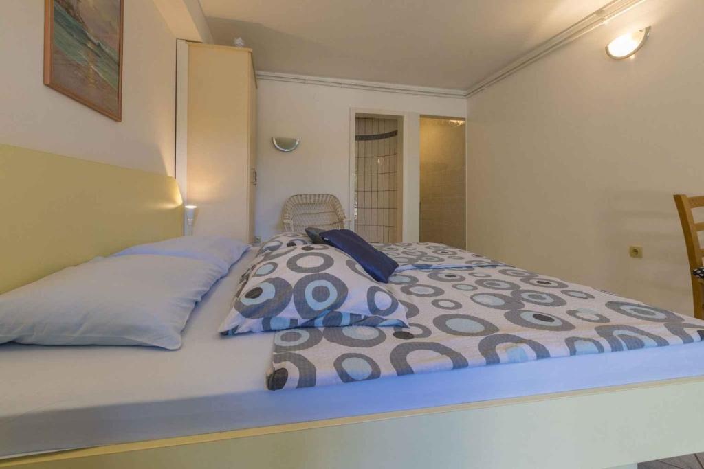 Postel nebo postele na pokoji v ubytování One-Bedroom Apartment in Crikvenica XVII