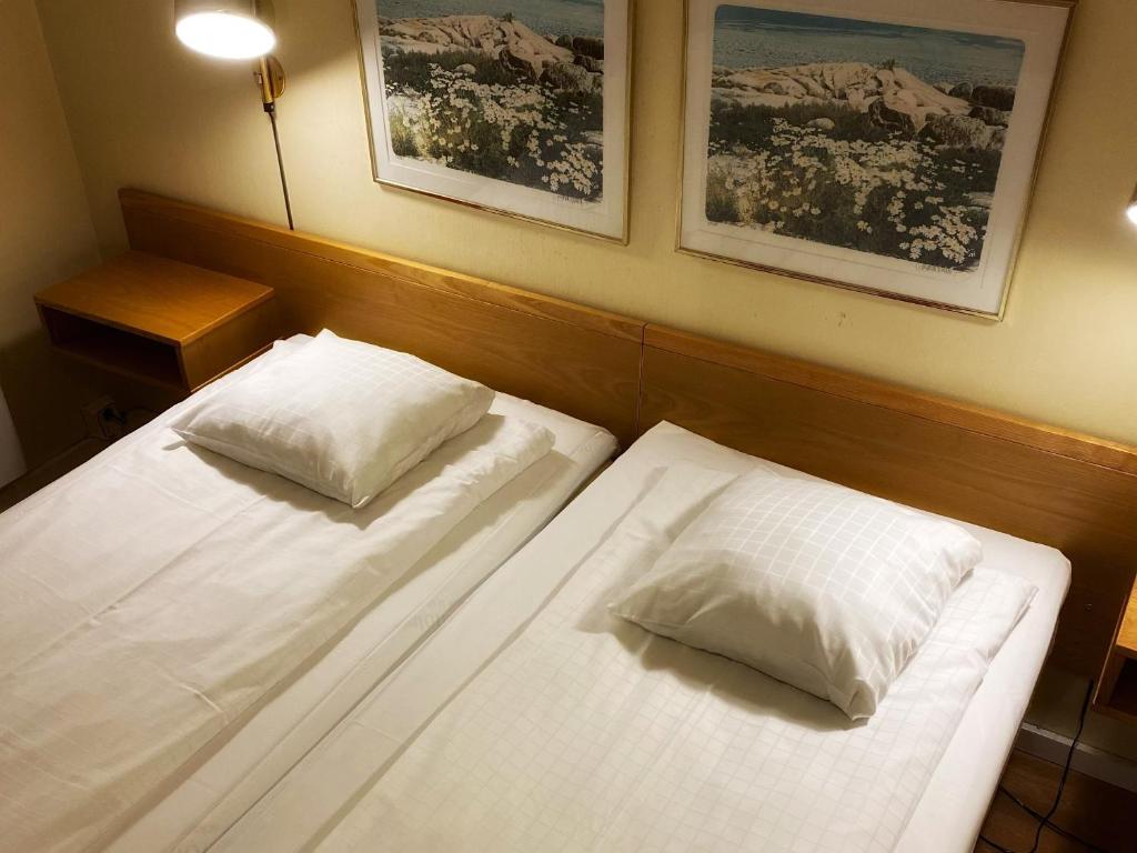 Postel nebo postele na pokoji v ubytování Hotel Örgryte