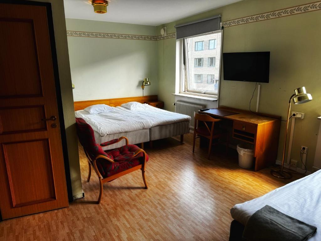 Postel nebo postele na pokoji v ubytování Hotel Örgryte