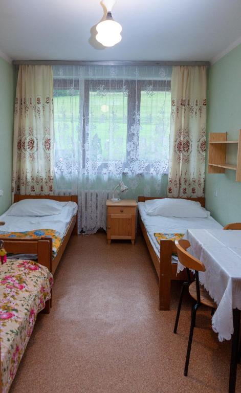 Postel nebo postele na pokoji v ubytování Dom Gościnny