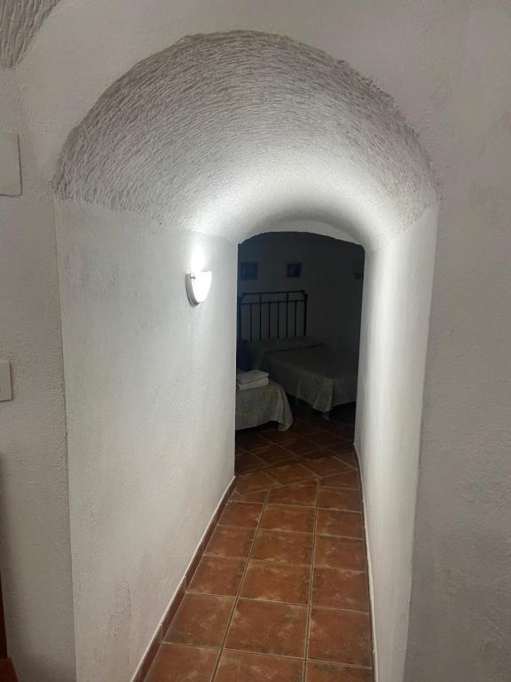 Postel nebo postele na pokoji v ubytování Cueva El Jaraiz