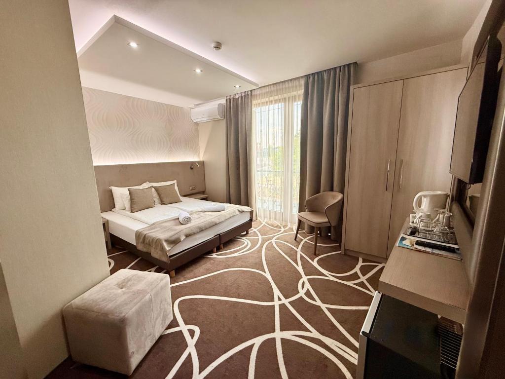 Postel nebo postele na pokoji v ubytování Mirage Hotel Sárvár