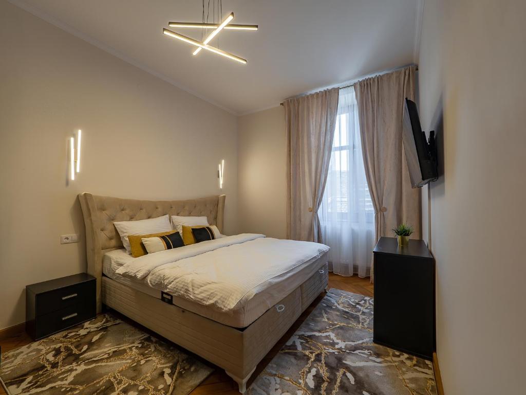 Postel nebo postele na pokoji v ubytování Mistic Apartament