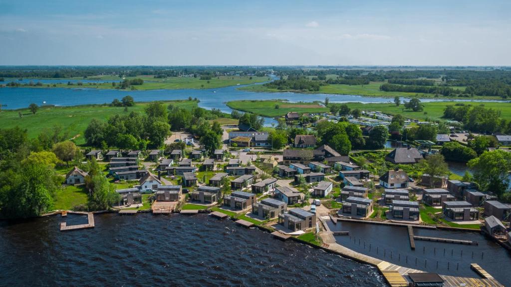 an aerial view of a village on a river at Vakantiepark De Wiedense Meren in Wanneperveen