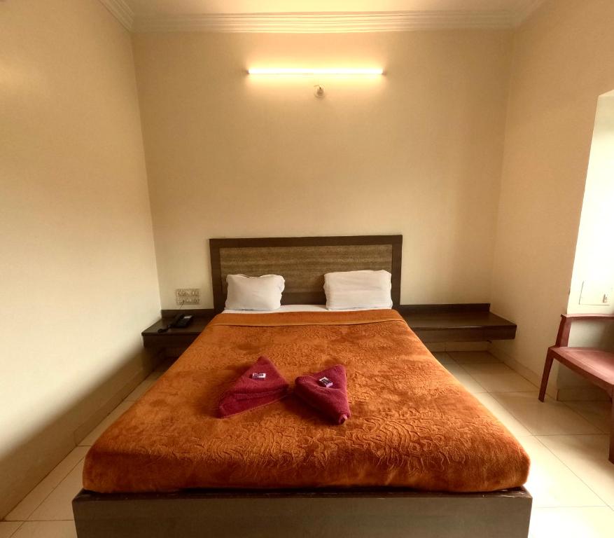 Postel nebo postele na pokoji v ubytování Hotel Laxmi Palace Newly Renovated