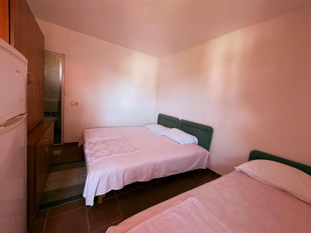 Letto o letti in una camera di Shkreli Apartments