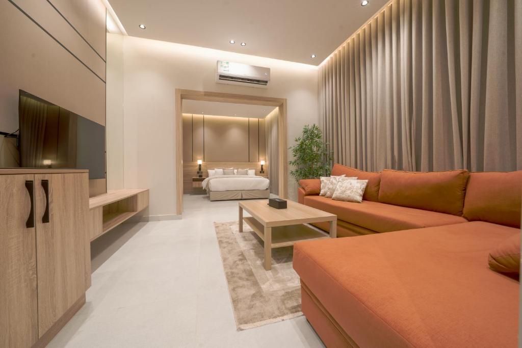 TV a/nebo společenská místnost v ubytování هاسيندا سويتس - Hacienda Suites