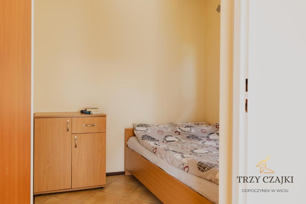 Postel nebo postele na pokoji v ubytování Trzy Czajki Domki letniskowe