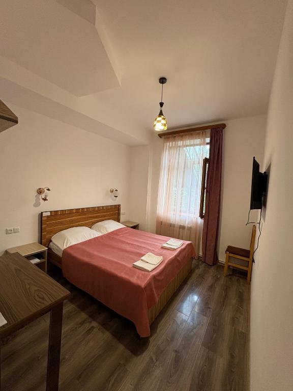 Postel nebo postele na pokoji v ubytování Mthnadzor