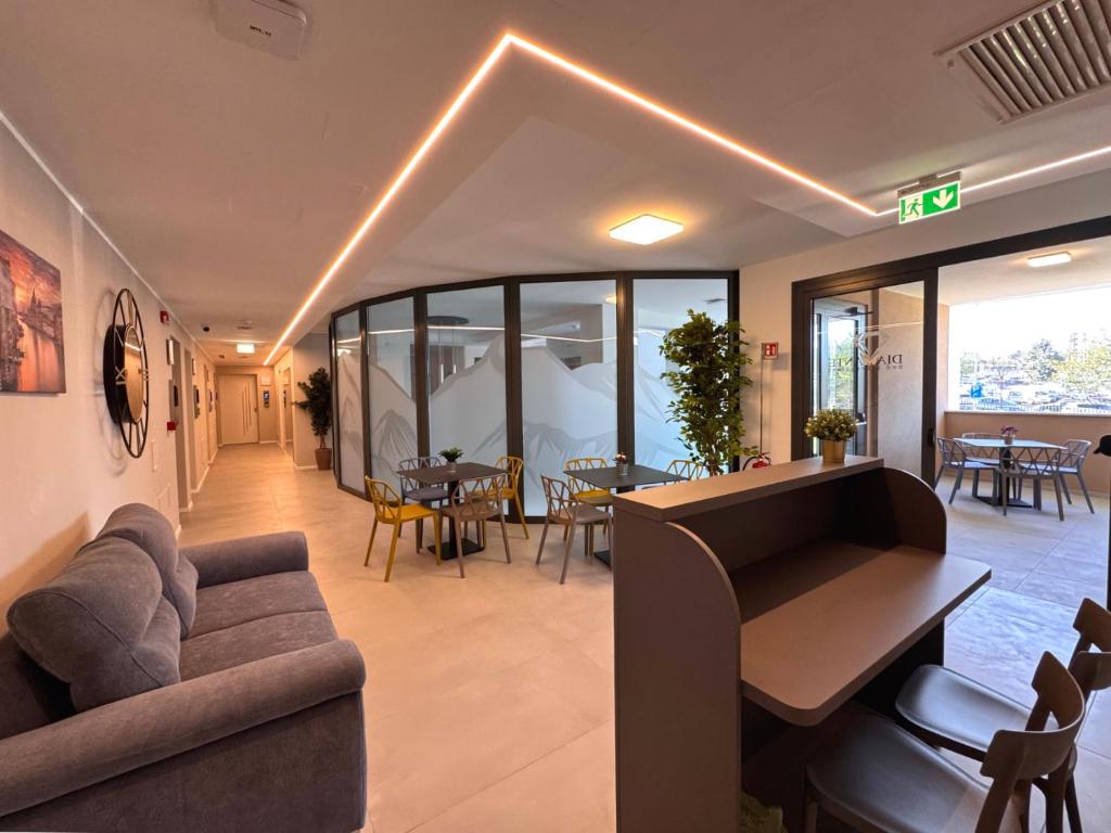 a living room with a couch and a table and chairs at B&B Diamante in Chieti