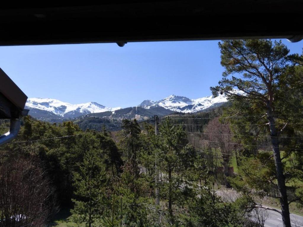 a view of snow capped mountains from a train window at Appartement T2 Mezzanine Confort 6 Pers, Balcon, Parking - FR-1-804-5 in Enchastrayes