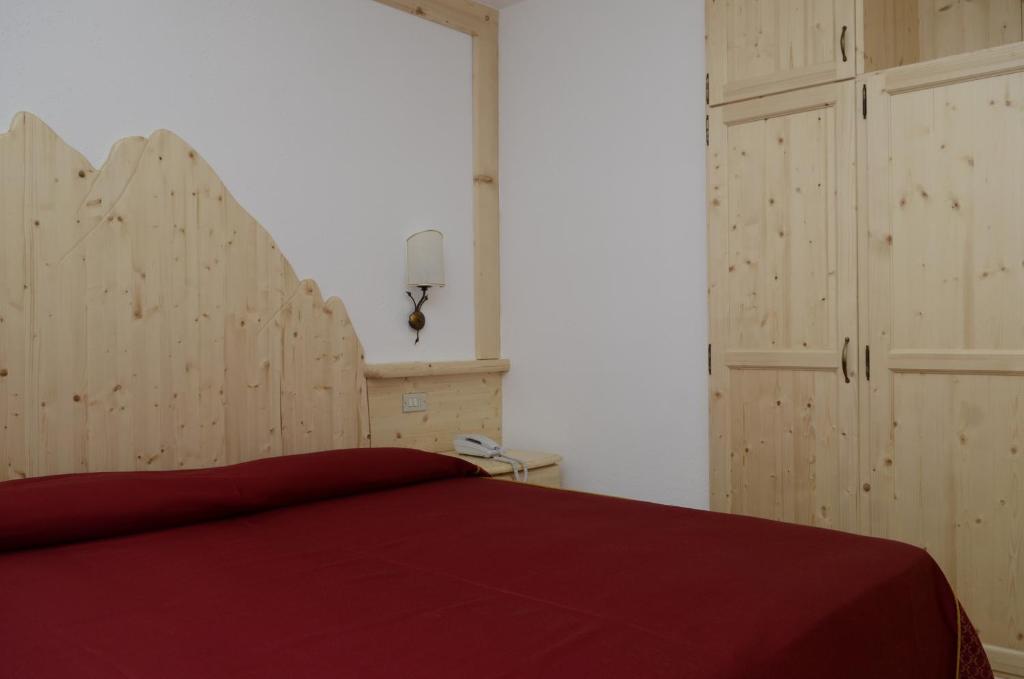 Postel nebo postele na pokoji v ubytování Hotel Corona