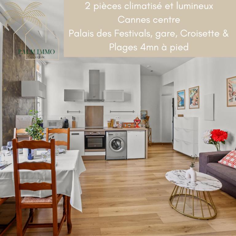 Il comprend un salon avec une table à manger et une cuisine. dans l'établissement La Dolce Vita T2 au calme plein coeur de Cannes, à Cannes