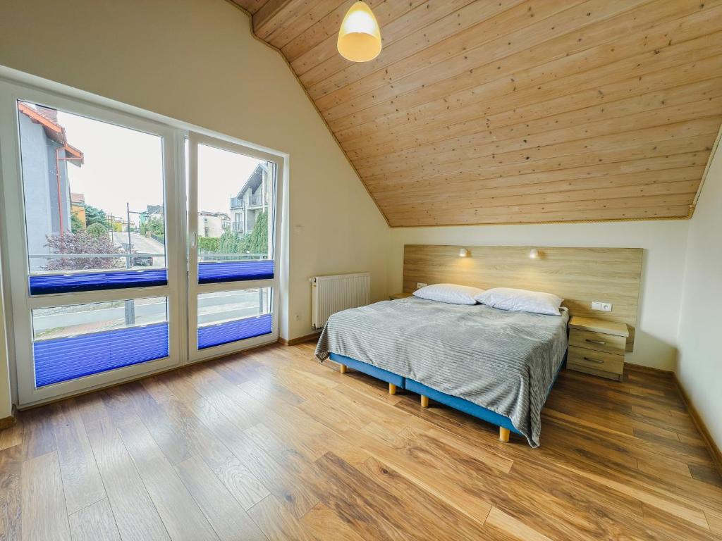 Posteľ alebo postele v izbe v ubytovaní Rellim Apartamenty