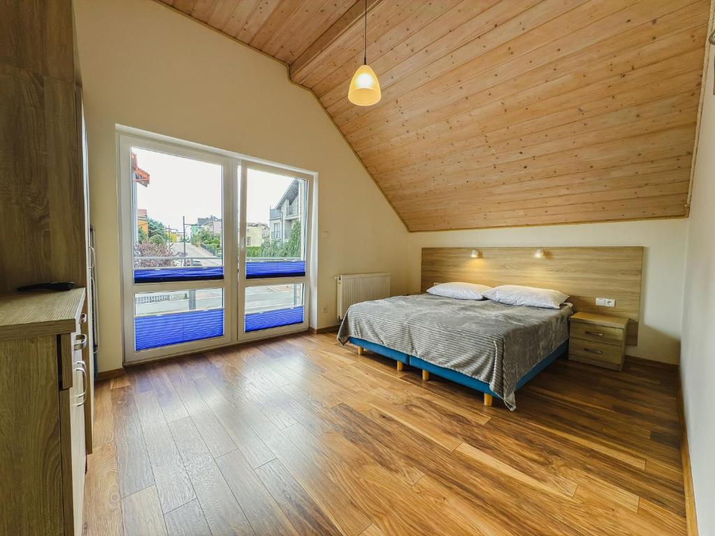 Posteľ alebo postele v izbe v ubytovaní Rellim Apartamenty