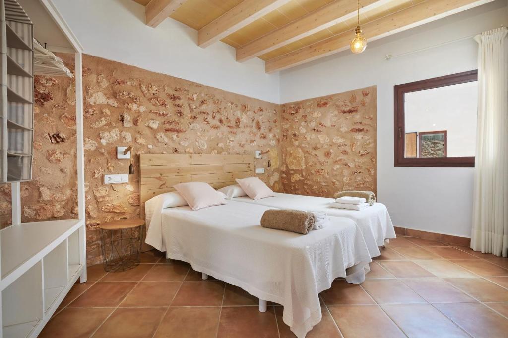 a bedroom with two beds in a room at Son Rossinyol Nou - Sa Bovera in Campos