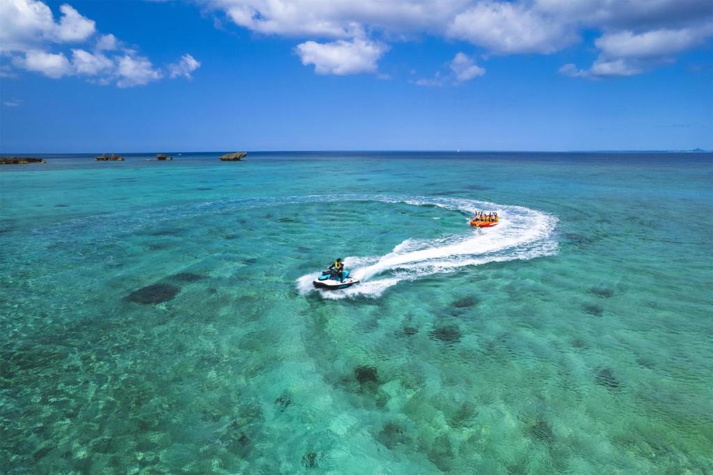 two boats in the water in the ocean at Hyatt Regency Seragaki Island Okinawa in Onna
