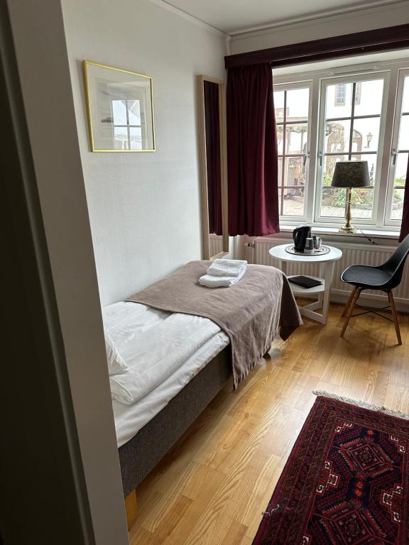 Postel nebo postele na pokoji v ubytování Värdshuset Hwitan