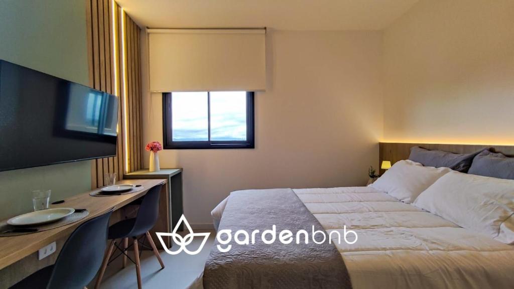 Katil atau katil-katil dalam bilik di Studio Moderno ao Lado do Shopping Palladium