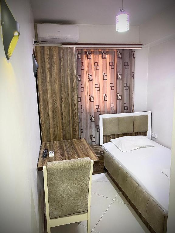 Postel nebo postele na pokoji v ubytování Hotel Heimli