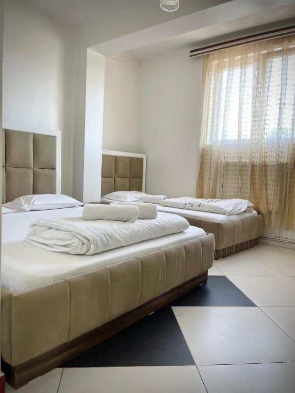 Postel nebo postele na pokoji v ubytování Hotel Heimli