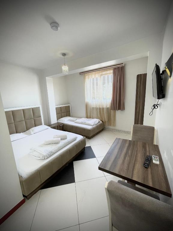 Postel nebo postele na pokoji v ubytování Hotel Heimli
